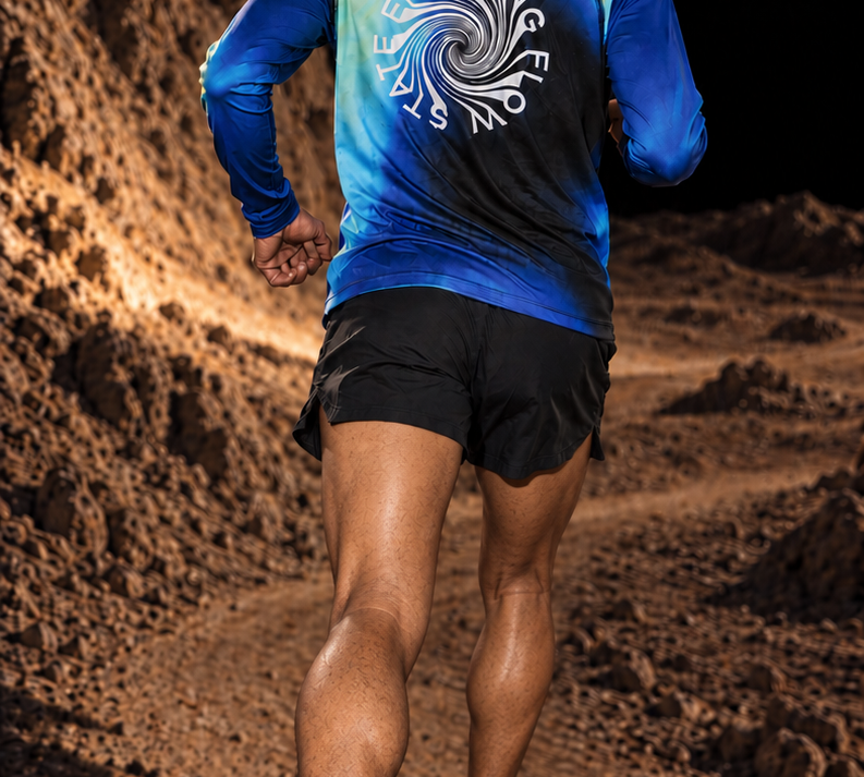 Runner shown from behind wearing the Entering Flow State long-sleeve TempoTech tee on a rocky trail.
