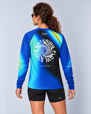 Back studio view of a female model wearing the Entering Flow State long-sleeve TempoTech running tee with black Shift-5 shorts
