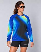 Front studio view of a female model wearing the Entering Flow State long-sleeve TempoTech running tee with black Shift-5 shorts