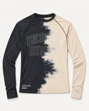 Front view of the Half Dye long-sleeve TempoTech running tee with charcoal and cream split-dye pattern and outlined Uncommon Runner chest lettering
