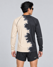 Back studio view of a male model wearing the Half Dye long-sleeve TempoTech running tee with upper-back wordmark and sleeve checker details