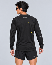 Back studio view of a male model wearing the black and yellow Keep Running Weird long-sleeve TempoTech running tee with black Phanto-3 race shorts