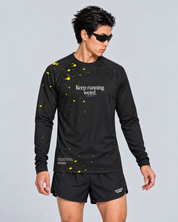 Front studio view of a male model wearing the black and yellow Keep Running Weird long-sleeve TempoTech running tee with black Phanto-3 race shorts